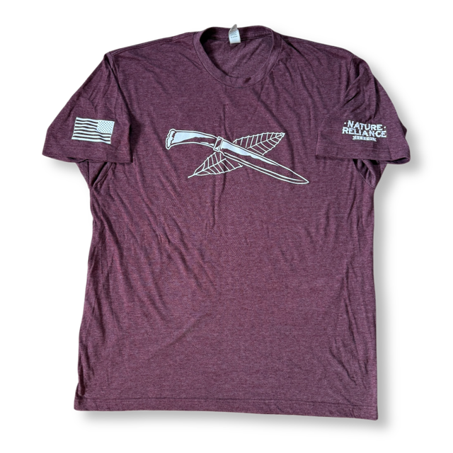 Maroon T-Shirt ā Rich maroon Nature Reliance School t-shirt with a soft cotton-poly blend and tear-away label.