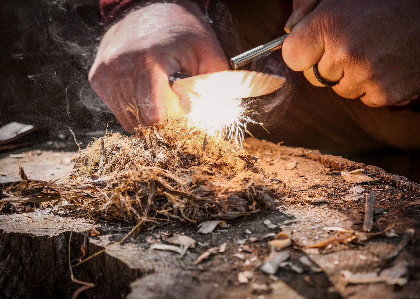 Ferro Rod starting a fire with tinder shavings