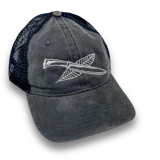 Nature Reliance School trucker hat in all-black, featuring soft cotton front, mesh back, and NRS logo