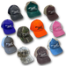 Collection of Nature Reliance School trucker hats in multiple colors, each featuring the embroidered knife and feather logo — camo, blaze orange, blue, pink, green, brown, gray, and black designs for outdoor and survival enthusiasts.